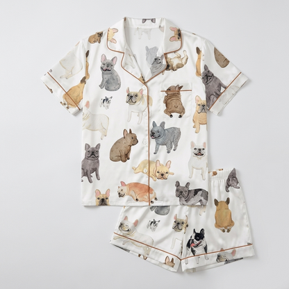 Women's satin pajama set with painted gray, fawn, white and black French bulldogs on white with copper piping - flat lay