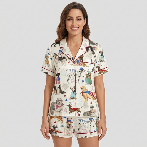 Women's satin pajama set with dogs in flag bandanas and crowns among stars and fireworks on white - short sleeve and shorts