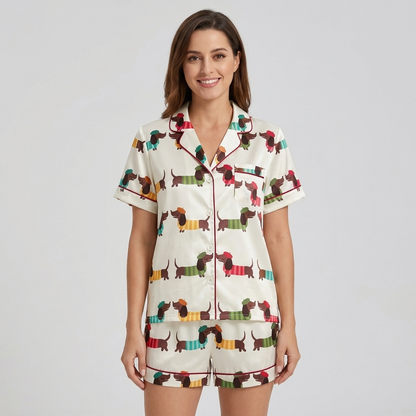 Women's satin pajama set with dachshunds in mustard, teal, green and red striped sweaters on white - short sleeve and shorts