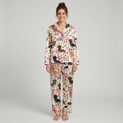 Women's satin pajama set with dachshunds among pink roses, peach blooms and leaves on white - long sleeve and pants