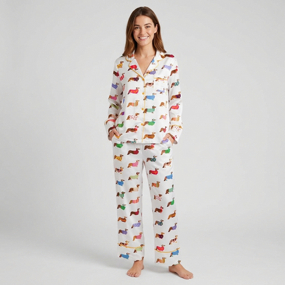 Women's satin pajama set with corgis in polka dot, striped and heart knit sweaters on white with golden piping - long sleeve and pants