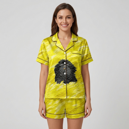 Women's satin pajama set with one shaggy black dog on a yellow painted field - short sleeve and shorts