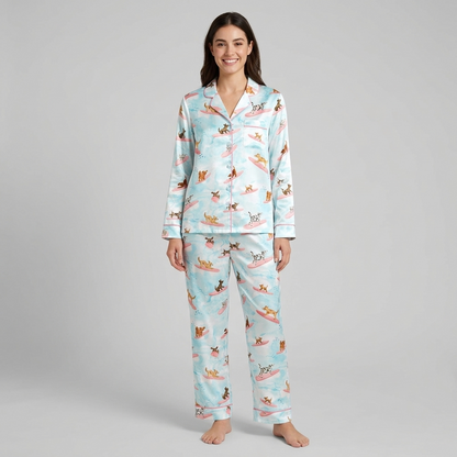 Women's satin pajama set with dalmatians and terriers surfing on pink boards on watercolor blue - long sleeve and pants
