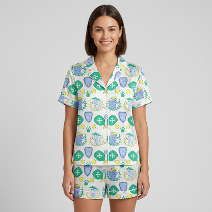 Women's satin pajama set with laurel-wreathed poodles in sun visors with paddles and balls on white - short sleeve and shorts