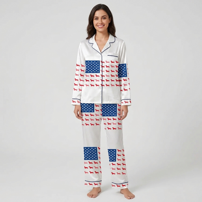 Women's satin pajama set with a flag of paw prints and red dachshunds across the chest on white - long sleeve and pants