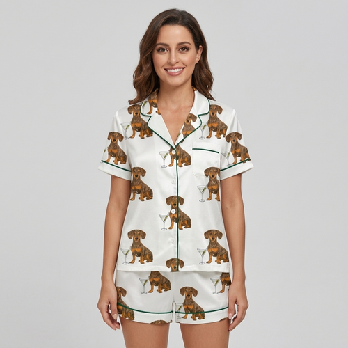 Women's satin pajama set with dachshunds beside martini glasses with olives on white with green piping - short sleeve and shorts