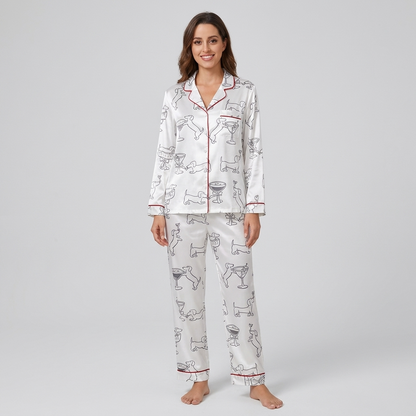 Women's satin pajama set with black-ink dachshunds clinking glasses in martini coupes on white with red trim - long sleeve and pants