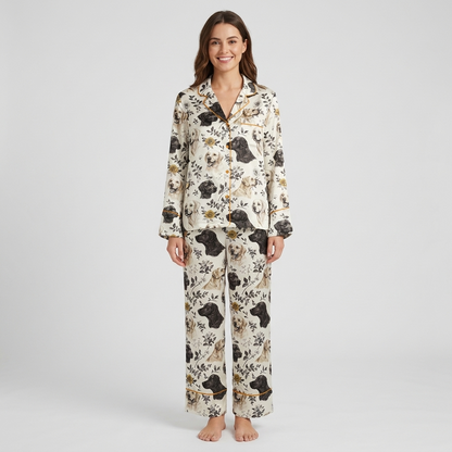 Women's satin pajama set with black and golden Labradors among leaves and wildflowers on white - long sleeve and pants