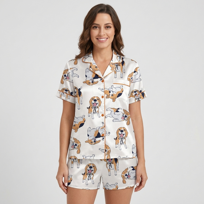 Women's satin pajama set with tricolor beagles in black ribbon collars rolling over on white with copper piping - short sleeve and shorts