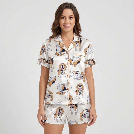 Women's satin pajama set with tricolor beagles in black ribbon collars rolling over on white with copper piping - short sleeve and shorts