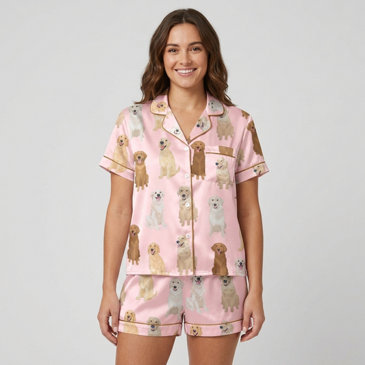 Women's satin pajama set with golden retrievers from cream to deep gold on bubblegum pink - short sleeve and shorts