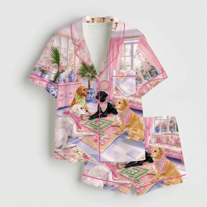 Women's satin pajama set with Labradors in bandanas playing mahjong in a pink chinoiserie parlor - flat lay