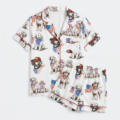 Women's satin pajama set with golden retrievers in star bandanas and ball caps carrying little flags - flat lay