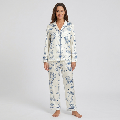 Women's satin pajama set with blue-sketched golden retrievers with ringed planets and stars on white - long sleeve and pants