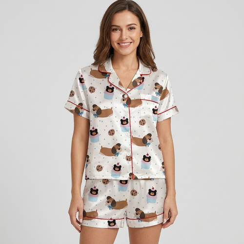 Women's satin pajama set with dachshunds in bow ties with cookies and cupcakes on white - short sleeve and shorts