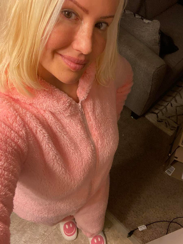 Bunny wearing the fuzzy onesie